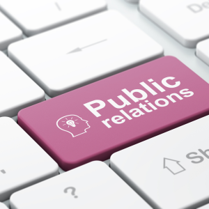 A pink public relations key on a keyboard