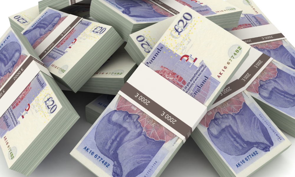 Stack of £20 notes in a pile