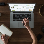Top down view of using a laptop for GEO and SEO